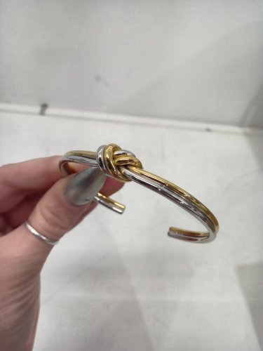 women's waldor & co. dual knot bangle - water resistant and tarnish-free - 25mm x 25mm - 316l stainless steel silver and 14k gold polish. image 5
