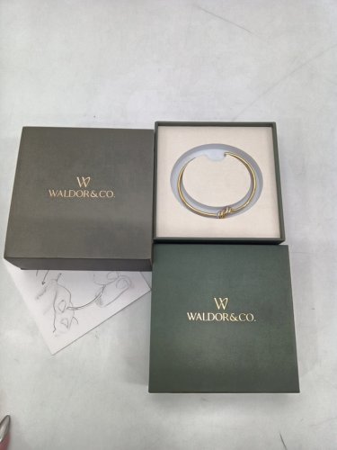 women's waldor & co. dual knot bangle - water resistant and tarnish-free - 25mm x 25mm - 316l stainless steel silver and 14k gold polish. image 2