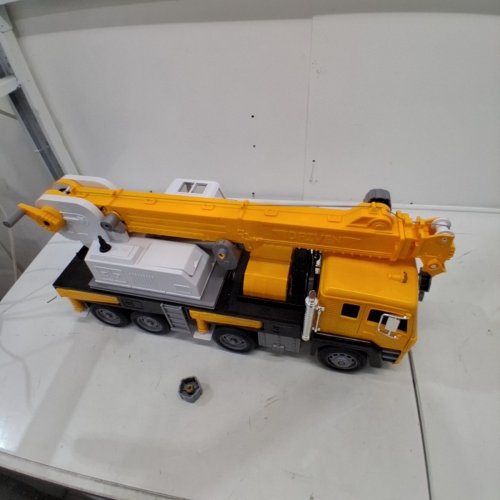DRIVEN BY BATTAT JUMBO CRANE TRUCK TOY WITH MOVABLE CRANE ARM, SOUNDS, LIGHTS, CRANE BUCKET ATTACHMENT & MINIATURE CONSTRUCTION WORKER - 27" - YELLOW/BLACK/WHITE (MODEL: WH1362Z) image 3