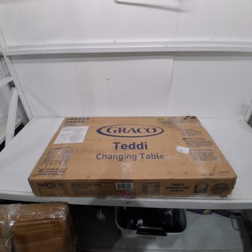 GRACO TEDDI CHANGING TABLE WITH WATER-RESISTANT CHANGING PAD - 2 OPEN SHELVES - 30LBS WEIGHT CAPACITY - LIGHT BROWN (MODEL: 00524-2107-BW) image 5